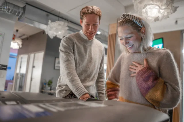 Two people using the printer at Bergen.Works