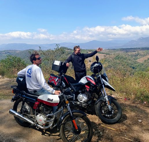 Two people with motorbikes enjoying the landscape in Chiapas Mexico