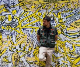 Experiences - Cultura Distinta - Things to do in San Cristobal Person in front of graffiti piece San Cristobal, Mexico
